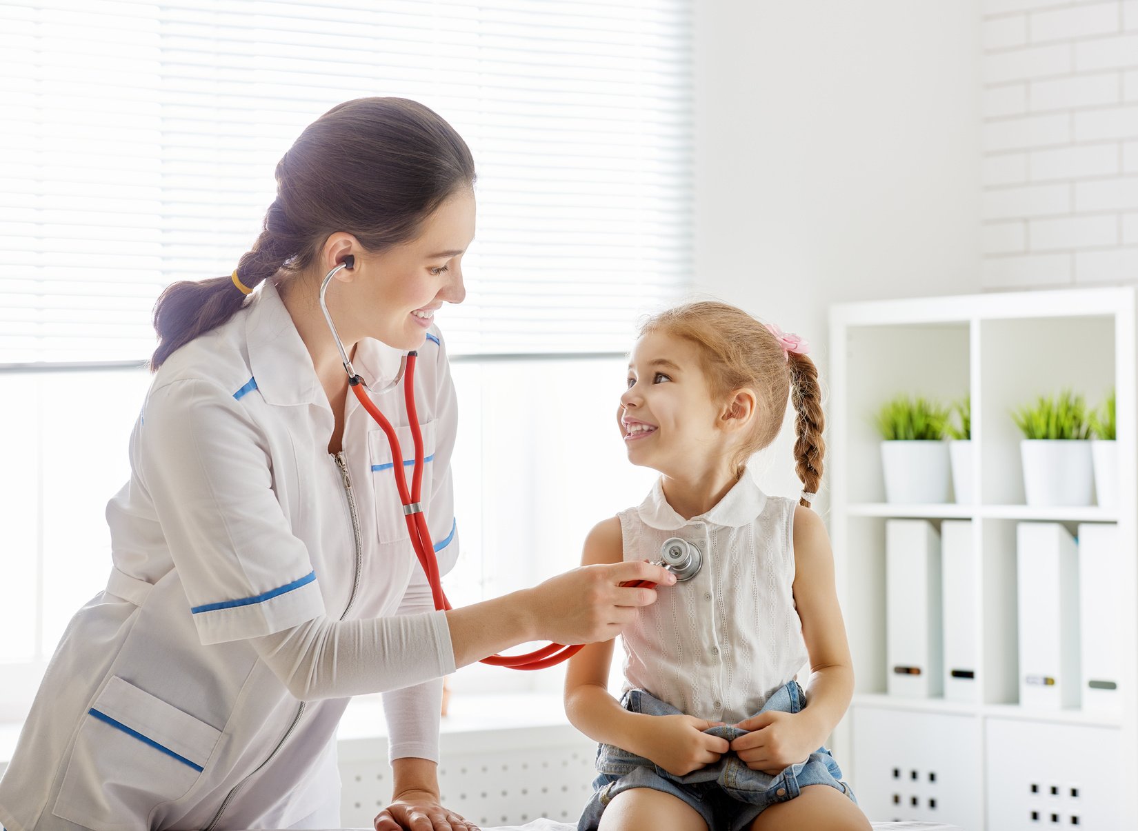 doctor examining a child